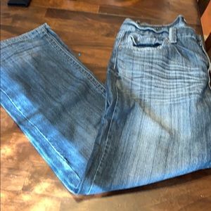 Men’s CJ Black low rise boot cut jeans. 34/32